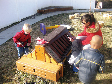 Students and a teacher investigate the Toddler Music Station at A to Z Child Care in American Fork, Utah, last winter.