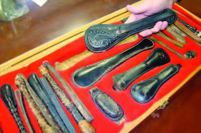 Weighted devices like saps and blackjacks form part of Sheriff Lain’s collection. He also owns a tear gas gun, ball and chain and several truncheons from the 1830s. He makes an effort to group items in ways that present a picture of the item’s history, or of the region from which they come. (Photo by Dee Dunheim)