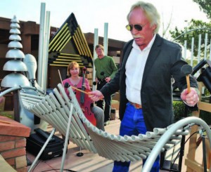 Sedona, Ariz., Mayor Rob Adams plays the opening notes of an inaugural concert performed on Freenotes outdoor instruments