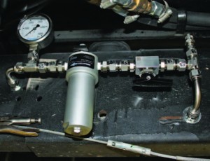 Pictured is a CNG highpressure fuel line with serviceable components.