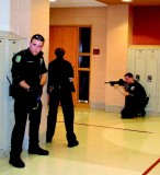 Officer Elliot Pedersen and Sergeant Jennifer Myers of the Plainfield Police Department and Officer Dan Dougherty of the Shorewood Police Department take part in the mock training exercise.