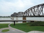 The Louisville side of the Big Four Bridge, pictured, opened in 2013. Since the opening of the Indiana-side ramp this year, walkers and bikers can now not only cross the Ohio River on the bridge but continue into downtown Jeffersonville to eat or shop. (Photo by Diana Likens)