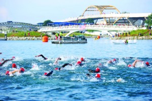 Athletes take off at the start of the 2015 USA Triathlon Olympic Distance National Championships in Milwaukee in August. The race, held as part of USA Triathlon’s Age Group National Championships weekend, saw more than 2,600 finishers and featured a 1,500-meter swim in Lake Michigan, followed by a 40K bike ride and 10K run. (Photo: Rich Cruse/crusephoto.com)