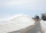 A snowblower and county truck work together to remove large drifts following a blizzard in January 2014. (Provided by APWA Winter Maintenance Technical Committee)