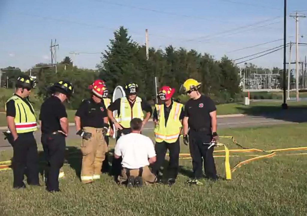 Fire Chief Kirk Allen with the Kansas, Ill., Fire Protection District conducts an outdoor training exercise intended to teach fi refi ghters how to measure how many gallons of water are flowing through the hose each minute. (Photo provided)