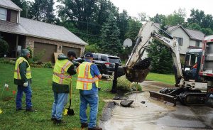 The integration of politics at a local level can prove to be a hindrance when providing citizens with quality services. There is no liberal or conservative approach to fixing a broken sewer line or to filling a pothole. Pictured, Cranberry Township public works employees repair a waterline break. (Photo provided)