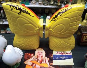 The Dollywood butterfly wing salt and pepper shakers, autographed by Dolly Parton, are among the variety of celebrityinspired sets on display at the museum. (Photo provided)