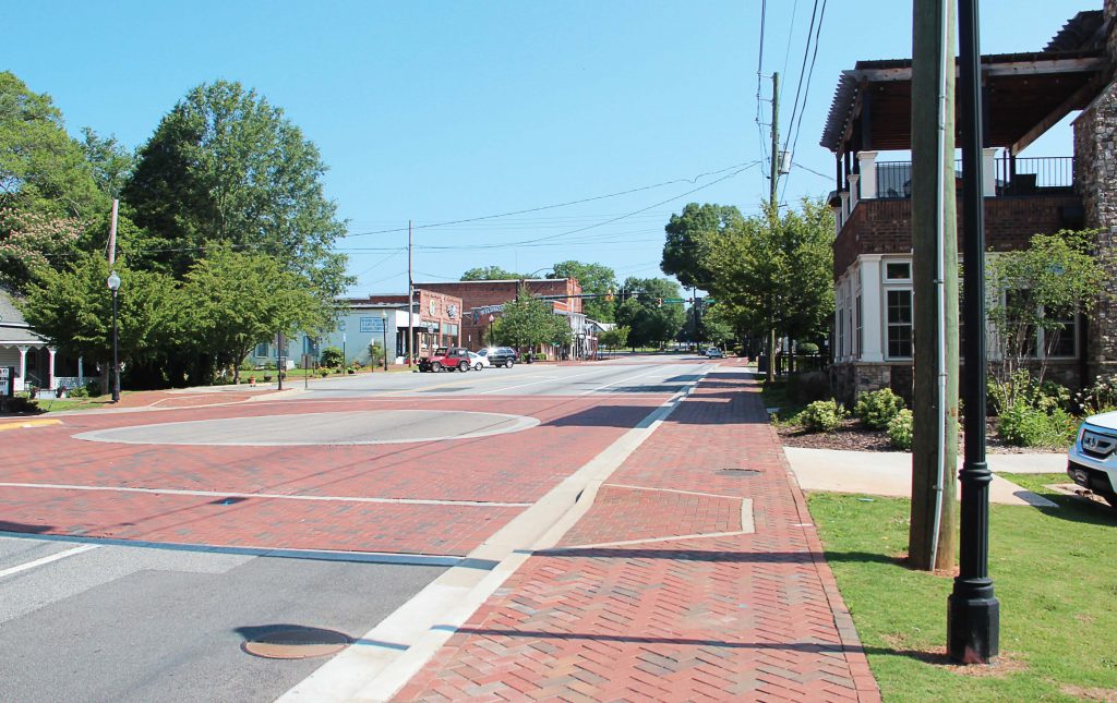 Kennesaw, Ga., passed ordinance Sec. 34-21 in 1982, which mandates that residents own a gun; however, the city included plenty of loopholes so residents actually don’t have to own one. Pictured is Kennesaw’s Main Street. (Public domain)