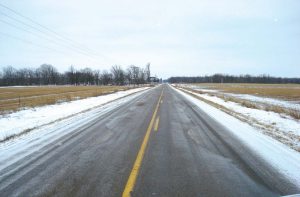 Pictured are roads in Polk County, Wis., that have been treated with a cheese brine mixture. (Photos provided)