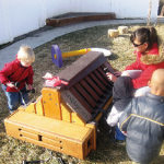 Students and a teacher investigate the Toddler Music Station at A to Z Child Care in American Fork, Utah, last winter.