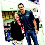 Account Executive Christi Sausaman with Indy car driver Graham Rahal at the Holmatro exhibit.