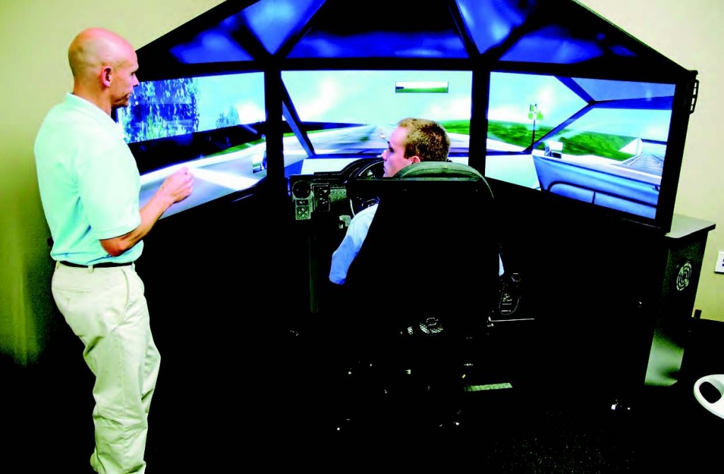 defensive driving David Baxter provides instruction to an officer participating in the Arkansas Municipal League’s defensive driving program.
