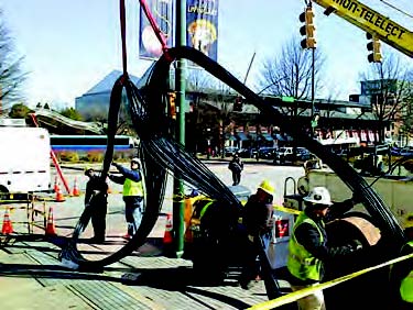 EPB crews install bundled fiber optic cables in downtown Chattanooga.