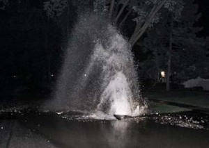 Workers in Texarkana, Texas, install a surge suppressor to reduce water hammer in their system and water main breaks.