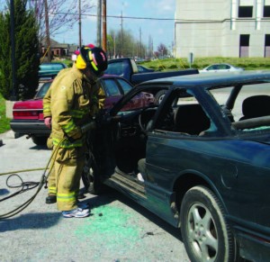 Springfield, Mo., CAmP participants use the Jaws of Life during the fire department’s program day. CAmP is designed to give city employees a better understanding on how the city operates. 