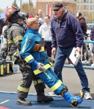 part of the Scott Firefighter Combat Challenge was the rescue of a 175-pound “victim.” Thomas Gies, Merrick FDNYC, pictured, won his early heat.