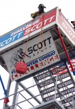 Tim Walker of the Pratt, W.V., Fire Department hauls a 42-pound doughnut to the top of a five-story tower at the beginning of the Scott Firefighter Combat Challenge individual competition April 25 at FDIC.