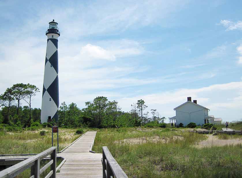 The lighthouse at Cape Lookout National Seashore, North Carolina, is maintained by National Park Service park rangers. The park’s Keepers’ Quarters Museum is on the right. (Photo provided)