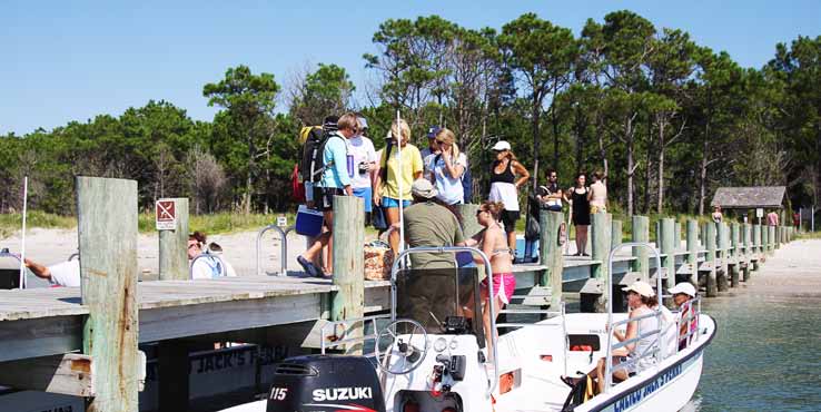 Visitors board a ferry to Cape Lookout, an island under the jurisdiction of the National Park Service. General maintenance on the island is done by federal employees while the lighthouse’s light is maintained by the U.S. Coast Guard. (Photo provided)