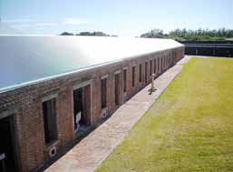 Deteriorated rainwater pipes at the barracks building of Fort Zachary Taylor had dampened the structure’s walls — prompting the search for a repair solution.