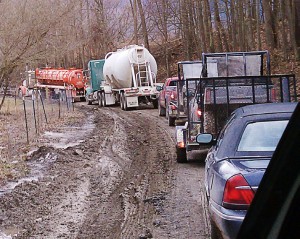 Above, left to right: This dead-end gravel township road in Pennsylvania historically had a traffic count of fewer than 30 vehicles per day — mostly cars and light agricultural equipment. This 20-minute-long traffic jam to reach the two-lane state road a quarter of a mile away took place after shale gas development came to the township. (Photo provided)