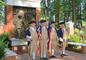 The Roswell, Ga., color guard stands at the Faces of War Memorial. The city hosts “Roswell Remembers” each year, a celebration that draws in excess of 6,000 people, making it the largest Memorial Day ceremony in Georgia. (Photo courtesy of Roswell Recreation, Parks, Historic and Cultural Affairs Dept.)