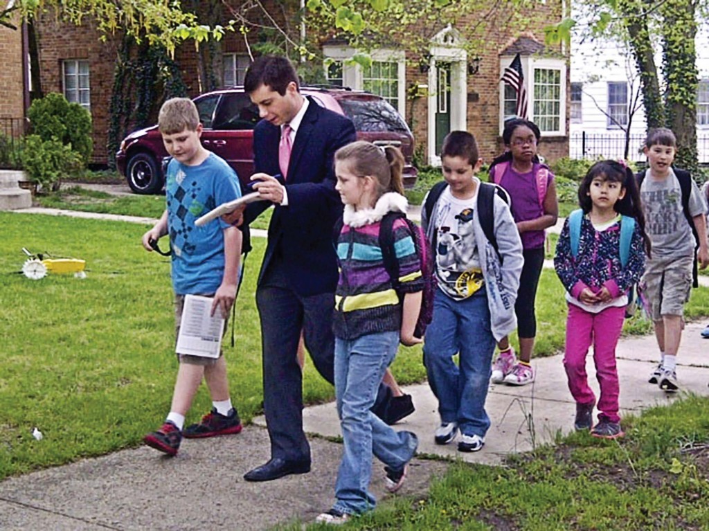 Mayor Pete Buttigieg, South Bend, Ind., walks to school with a group of local students in May 2013 in observance of National Walk/Bike to School Day. (Photo provided)