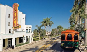 The National Park Trolley ambles past Seminole Theater in Homeland, Fla.’s downtown historical district. The theater, built in 1921, was rebuilt in 1940 following a devastating fire. After its second near-destruction by Hurricane Andrew, the theater closed its doors in 1979. The exterior was recently renovated and the interior work awaits funding.