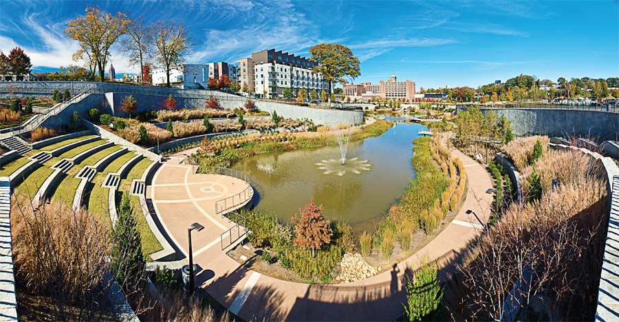 Incorporating the existing waterway, historic Fourth Ward Park in Atlanta, Ga., offers an enticing respite of natural beauty beneath the nearby towering urban edifices. Included in the oasis are a variety of decorative vegetation, a fountain, bike paths, walkways and an amphitheater. (Photo provided)