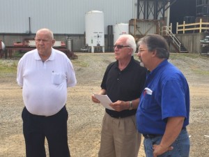 The Godwin Group founder Pat Godwin Sr., (white shirt) Architect Joseph Sekely III (black shirt), and Galion-Godwin general manager Carl Wilson (blue shirt), discussing construction.