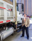 Grant Ervin, sustainability manager for the city of Pittsburgh, next to a truck fitted with Optimus Technologies’ renewable diesel solution.