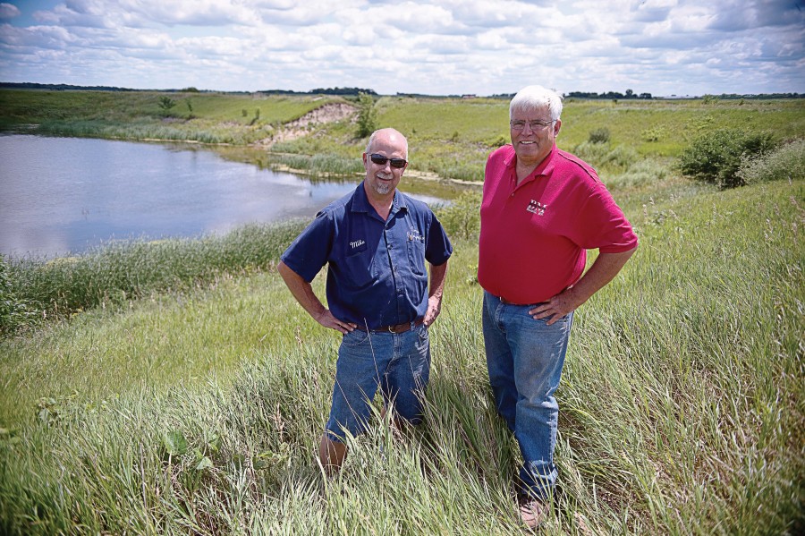 Mayor Mike Grote and BM Builders Owner Bill McMullen are proud of the final results of the Madelia ponds project. (Photo by Bre McGee)