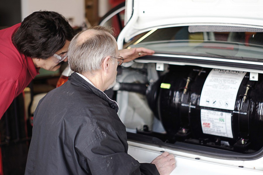 Technicians complete a natural gas cylinder check. Training is extremely important prior to the first alternative fuel vehicle arrival, since it builds technicians’ confidence. (Photo provided)