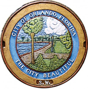 “The City Beautiful” is the first manhole cover relief done in color by artist Bobbi Mastrangelo and was exhibited in the Orlando Museum of Art in October. (Photo provided by Mastrangelo, from her Grate American Art portfolio)