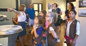 Ashley Carver, Morton Museum of Collierville history director, gives a local Girl Scout troop a tour