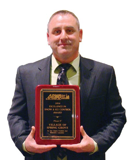 Matt Wittum, supervisor, Spring Grove Public Works Department, receives the Excellence in Snow and Ice Control Award from the Metro Chapter of the American Public Works Association last year.