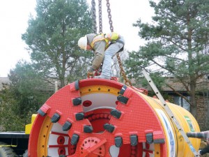 The TBM being lowered into the pit to begin excavation.