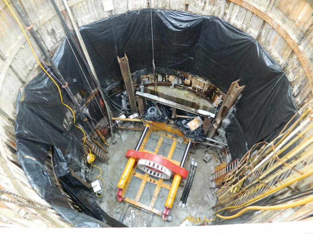 Construction crews place the tunnel boring machine in a pit adjacent to Lake Huron.