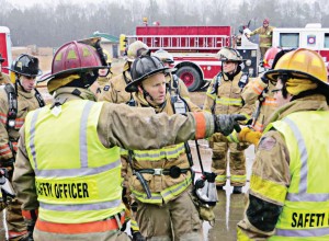 Participants in a KTF burn discuss at length the science behind fire behavior and how adjusting their responses to the details of a fireground situation might control it more effectively.