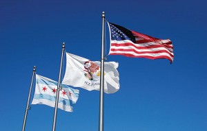 The Chicago flag has long been hailed as an ideal design. The stripes represent the sides of the city and its demarking bodies of water. The stars represent a founding event, the Chicago Fire, the World’s Columbian Exposition and the Century of Progress Exposition. The image is flown all over the city today. (Shutterstock photo)