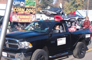 Mr. and Mrs. Oyster wave to the crowd during the Oyster Festival parade, one of two parades that take place during the two-day Urbanna Oyster Festival. With 160 entries, the oyster parade is the larger of the two. (Photo provided)