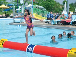 Successful municipal parks and recreation departments develop strategic marketing plans and document who is using the resources, while also developing ways — like this “log rolling” aquatic program in place in Carmel, Ind. — to bring in more users and increase revenues. (Photo provided)