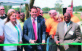 A ribbon cutting took place in August 2012 of a Pensacola Energy/ ECUA CNG station. Pictured in front, from left , are: Elizabeth Campbell, ECUA board member District 1; Pensacola Mayor Ashton Hayward; and Elvin McCorvey, ECUA board member District 3. (Photo provided)