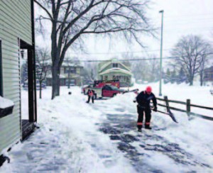 Greenfield, firefighters and paramedics returning to the scene of a call to finish shoveling and plowing a local gentleman’s drive. The kindness went viral worldwide, with a call to #ShovelItForward. (Photo provided)