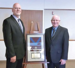 Reeder, left, and Larry Stevens, APWA president, during the APWA conference at which Reeder was named one of 2015 Top Ten Public Works Leaders. (Photo provided)