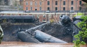 Lynchburg, Va., firefighters make sure all flames are out after a CSX train containing thousands of gallons of Bakken crude oil derailed in downtown Lynchburg in the middle of the week in 2014. 