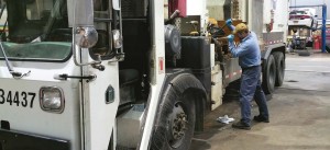 Durham, N.C., Master Mechanic Jorge Heavlin works on an automated refuse collection vehicle. (Photo provided)