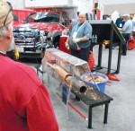 A 2016 WWETT exhibitor prepares a demonstration of pipe repair techniques that can be effected with minimal digging. (Photo by Chris Smith)