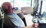 James Duram, K8COP, of the Muskegon County Emergency Communications Group, operates from a camper trailer during a Field Day weekend. Annual Field Day events held by the American Radio Relay League are meant to simulate how amateur radio communication should work during a disaster that takes out the permanently installed radio infrastructure. (Photo credit James Meyers, KC8PCJ)