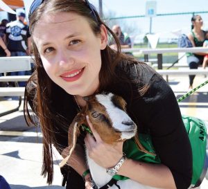 Campbell and Annie the goat promote tactics for coping with the stress and trauma of EMT work at a recent event.